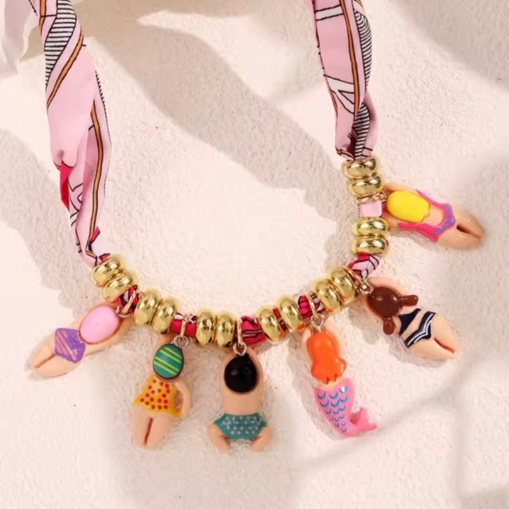 Anthropologie Gold Beaded Necklace with Colorful Swimmer Charms - Picture 2 of 3